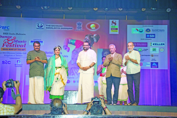 <p>Ms Devika with BKS president P V Radhakrishna Pillai, left, former Speaker of Kerala Legislative Assembly and NORKA Roots Vice Chairman P Sreeramakrishnan, centre, BKS general secretary Varghese Karakkal, second from right, and festival convenor Prashanth&nbsp;Govindapuram.</p>